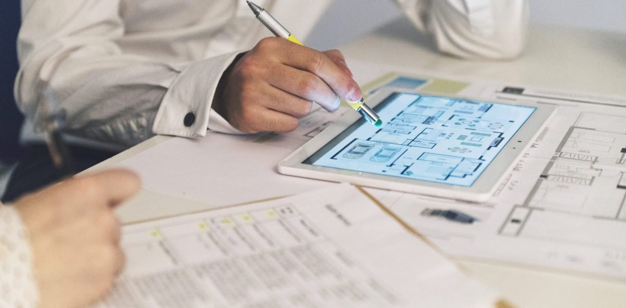crop-people-working-with-plans-tablet Roofarea